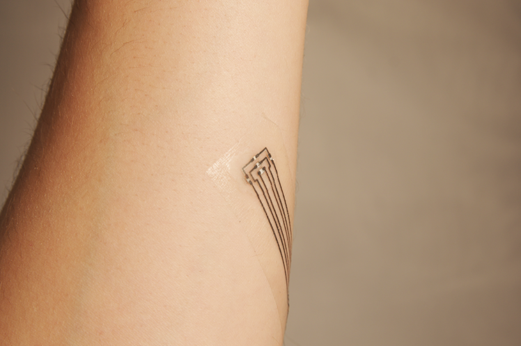 Thin electronic tattoo applied to arm