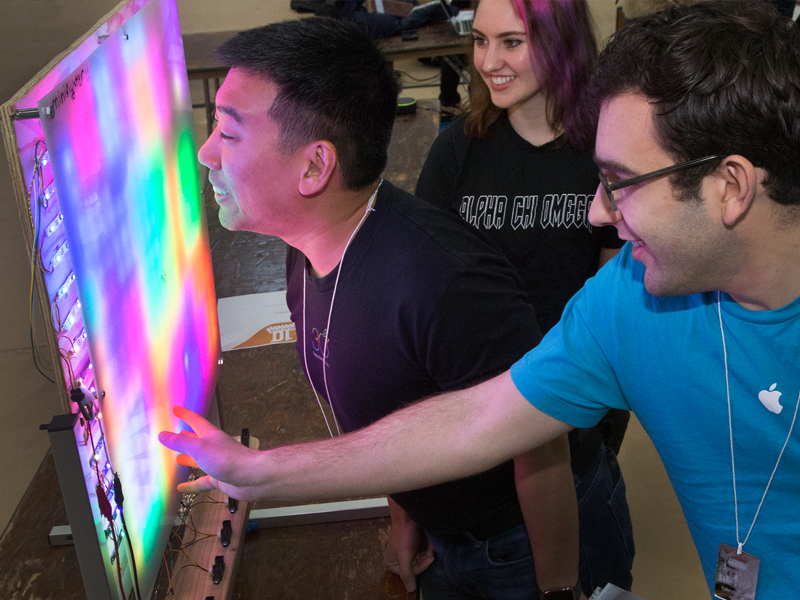 MechE, ECE, Human-Computer Interaction, and Psychology students Qianyi Chen, Candia Gu, Sarah Hempton, Shanel Huang worked together to create a colorful light panel called the miniFighter, which reacts to human proximity.