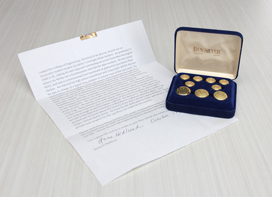 Letter from Anne Hedlund pictured next to the military buttons in a jewelry box