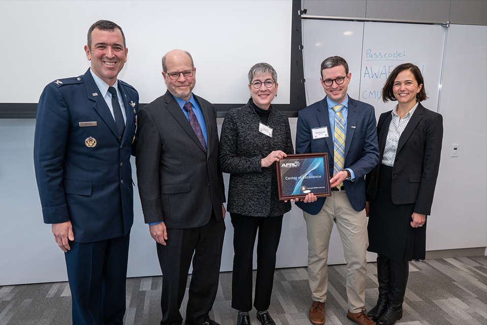 Jon Cagan, Liz Holm, Burcu Akinci, and a representative from the air force as well as another researcher holding the award.